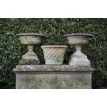 Garden Urns/Planters: A pair of composition stone urns, 20th century, 76cm.; 30ins high by 79cm.; 31