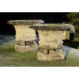 Garden Urns/Planters: A pair of substantial composition stone basket weave planters on stands, 2nd h