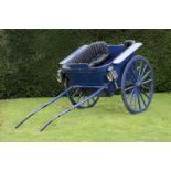 A Victorian pony traplate 19th centurywith carriage lamps and Rexine upholstery 290cm.; 142ins