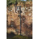 A bronze bell1st half 19th century with wrought iron wall bracket and fittings.bell diameter