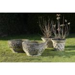 Garden urns/Planters: A pair of composition stone circular planters, mid 20th century, 74cm.; 29ins