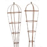 A pair of unusual wrought iron topiary frames modern with brass finials 239cm.; 94ins high