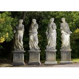 Garden Statuary: A set of four carved limestone Seasons modern on pedestals 246cm.; 97ins high