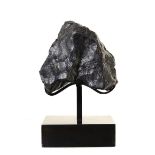 Fossils: A meteorite NWA L-Chondrite (type L4-6)on bronze stand16cm high overall0.76kgCollected in