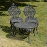 Garden Furniture: A suite of cast iron furniture,mid 20th century comprising two chairs and a