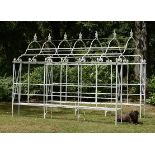 Garden Furniture: A wrought iron arbour enclosing seats,mid 20th century280cm high by 360cm long