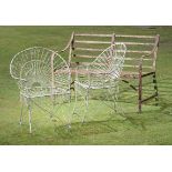 Garden Furniture: A strapwork wrought iron seat,late 19th century127cm long, together with a pair of