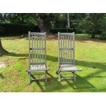 Garden Furniture: A pair of teak steamer deck chairs by Castle's Westminster,circa 1920with slated