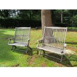 Garden Furniture: A pair of teak steamer two-seater deck chairs by Castle's Westminster,circa