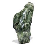 Minerals: A large green nephrite freeform 82cm wide 68kg Tools and amulets made of Nephrite date