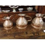 3 Copper measuring jugs