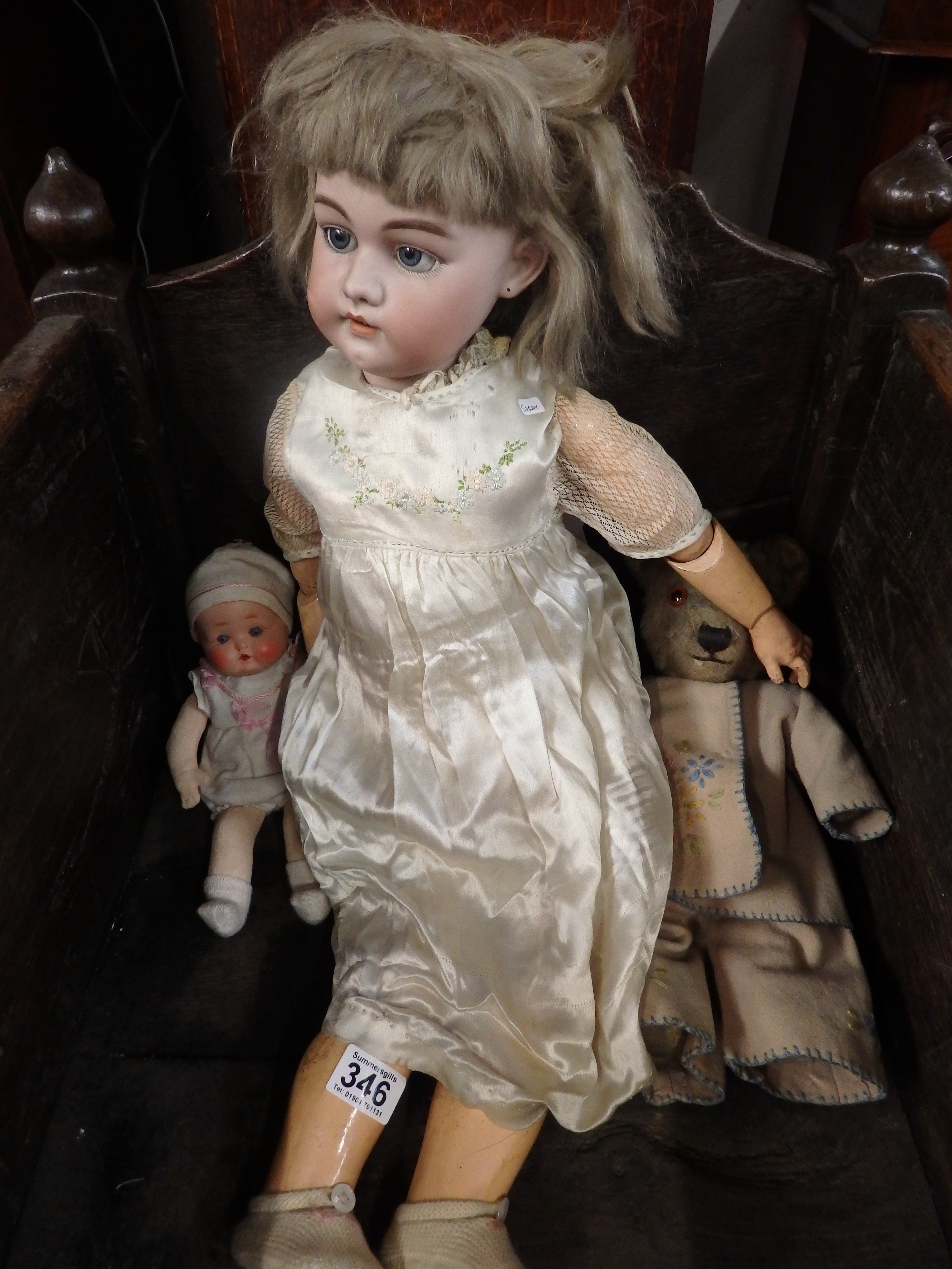 Large porcelain head doll, teddy and doll