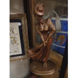 A Danel lady golfer sculpture 34cm