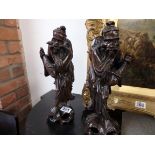 Pair of wooden carved Oriental figures