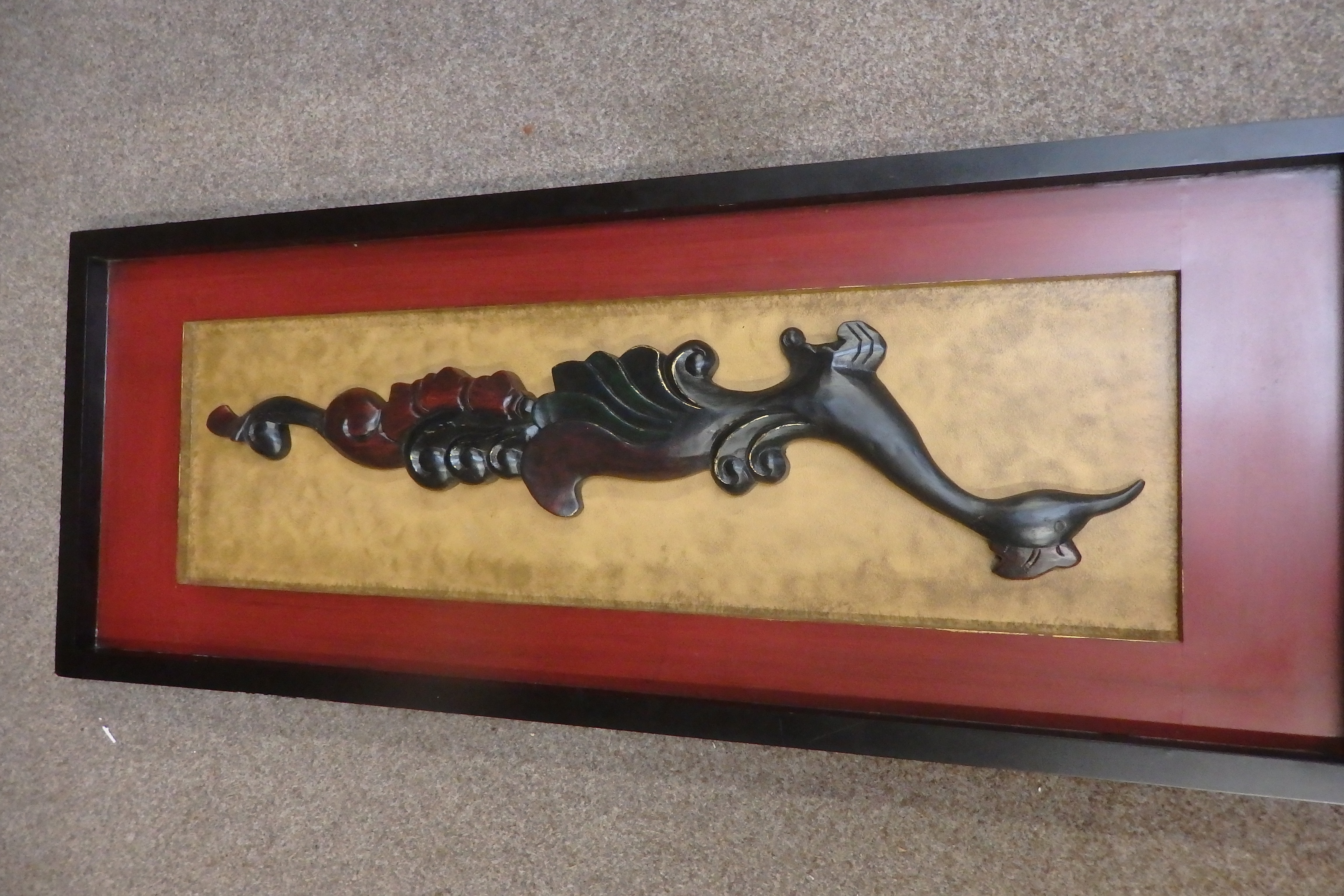 Wooden mounted carving