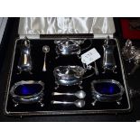 Silver cruet set in case