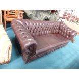 Brown leather chesterfield