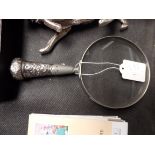 Silver magnifying glass