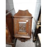 Oak carved corner cupboard