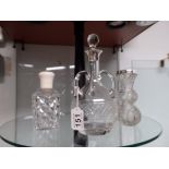 3 silver and cut glass bottles