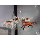 6 Beswick hounds and fox ( 1 tail damaged)