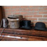 Top and bowler hat and leather case