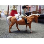 Beswick child on horse (ears damaged repaired)