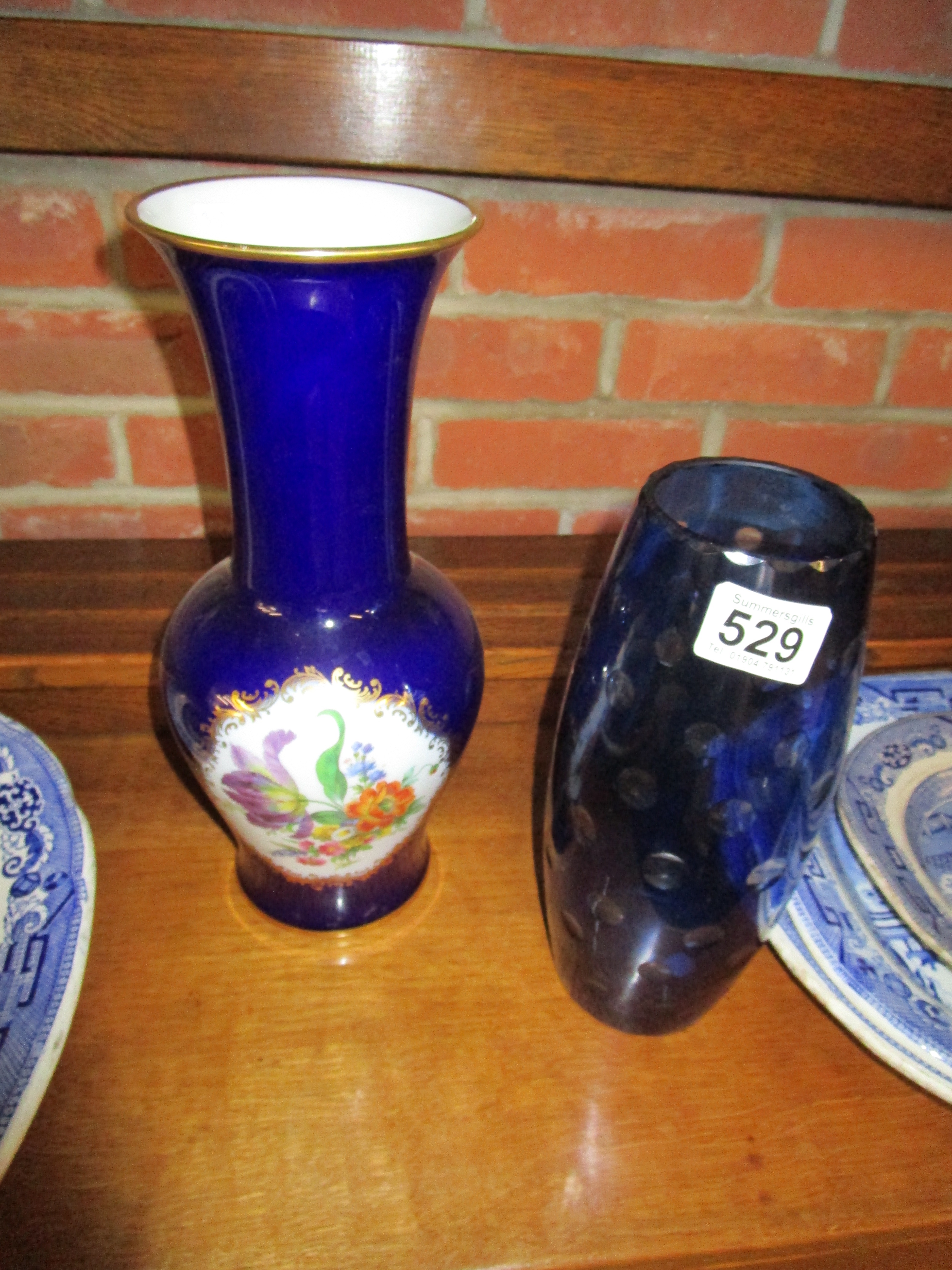 Blue glass vase and flowered vase