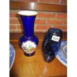 Blue glass vase and flowered vase