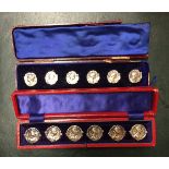 TWO CASED SETS OF SIX ART NOUVEAU SILVER BUTTONS With female portraits.