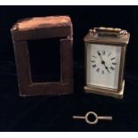 A 19TH CENTURY GILT BRASS CARRIAGE CLOCK rectangular shape with swan neck handle, four bevelled