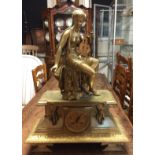 A 19TH CENTURY GILT BRONZE CHIMING MANTEL CLOCK Mounted with a figure of a Grecian maiden above a