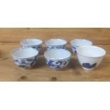 SIX ORIENTAL BLUE AND WHITE TEA BOWLS.