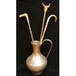 A LARGE 20TH CENTURY COPPER FLAGON With an Arts & Crafts hammered finish, applies with a large