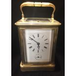 ROLLIN, PARIS, A VICTORIAN GILDED BRASS REPEATING CARRIAGE CLOCK The engraved gilded brass case