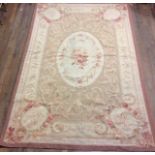 A LARGE 20TH CENTURY AUBUSSON RUG Floral spray design to central oval field on a light tan ground,