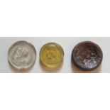 A LATE 18TH/EARLY 19TH CENTURY AMBER GLASS INTAGLIO MEDALLION Finely engraved with a view of the