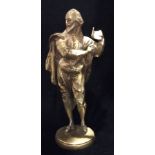 A LATE 19TH CENTURY BRASS STATUE OF WILLIAM SHAKESPEARE Standing and holding aloft a book and