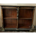 A 19TH CENTURY FRENCH BREAKFRONT EBONISED AND WALNUT FLOORSTANDING OPEN DOUBLE BOOKCASE Applied with