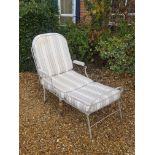 A VICTORIAN PAINTED WROUGHT IRON FOLDING CAMPAIGN CHAIR With striped upholstery, raised on turned