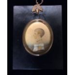 A 19TH CENTURY OVAL PENCIL PORTRAIT MINIATURE Drawing of a young girl with short hair, wearing a