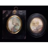 TWO 19TH CENTURY OVAL PORTRAIT MINIATURES ON IVORY A lady wearing blue robes and a mink stole,