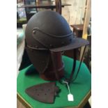 A 17TH CENTURY STYLE THEATRICAL LOBSTER POT IRON HELMET. Condition: one ear piece detached