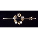 A VINTAGE 9CT GOLD AND PEARL SET BROOCH The circle of five pearls interspersed with textured