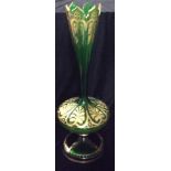 A 19TH CENTURY BOHEMIAN GLASS TRUMPET VASE With a castellated rim and bulbous base, with gilt