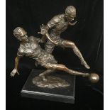 AFTER MILO, A BRONZE STATUE OF FOOTBALLERS Mid tackle, raised on a black marble base, signed. (h