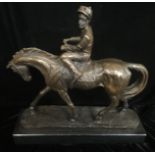 A BRONZE STATUE OF A JOCKEY ON HORSEBACK Raised on a black marble base. (h 30cm)