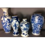 A COLLECTION OF FOUR ORIENTAL BLUE & WHITE PORCELAIN VASES a baluster shape, each painted with an