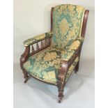 A 19TH CENTURY MAHOGANY OPEN ARMCHAIR With emerald green foliate upholstery, the shaped arm supports