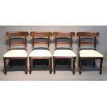 A SET OF FOUR REGENCY PERIOD MAHOGANY BAR BACK DINING CHAIRS With cream upholstered seats, raised on